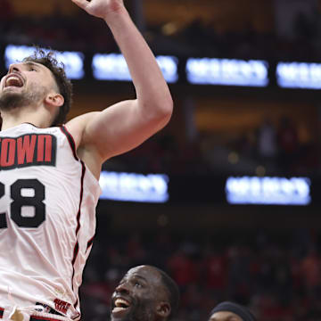 May 4, 2025; Houston, Texas, USA; Houston Rockets center Alperen Sengun (28) shoots the ball as Golden State Warriors forward Draymond Green (23) defends during game seven of the first round for the 2025 NBA Playoffs at Toyota Center. Mandatory Credit: Troy Taormina-Imagn Images