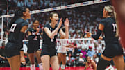 Nebraska volleyball players celebrate a point at Wisconsin. The Huskers won all three matches against the Badgers last season in straight sets. 