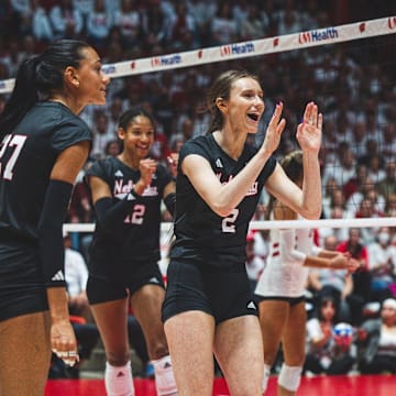 Nebraska volleyball players celebrate a point at Wisconsin. The Huskers won all three matches against the Badgers last season in straight sets. 