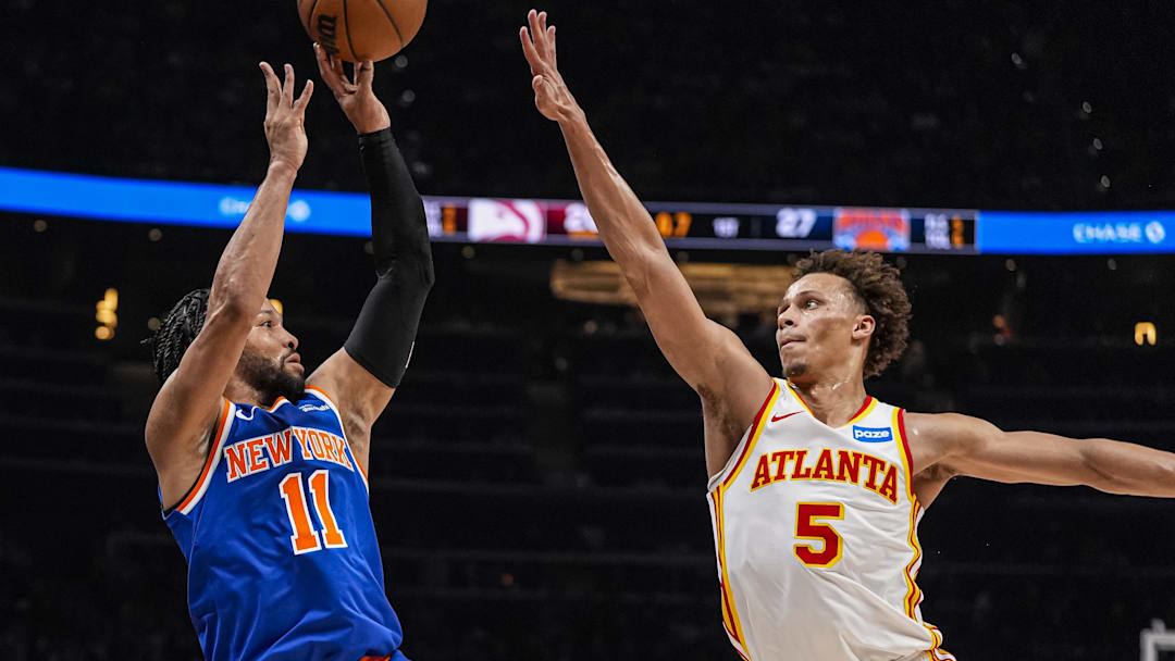 New York Knicks guard Jalen Brunson (11) shoots over Atlanta Hawks guard Dyson Daniels (5) during the first half at State Farm Arena. 