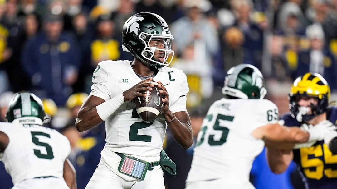 Michigan State quarterback Aidan Chiles looks before making a pass against Michigan during the first half at Michigan Stadium in Ann Arbor on Saturday, Oct. 26, 2024. Michigan State quarterback Aidan Chiles looks before making a pass against Michigan during the first half at Michigan Stadium in Ann Arbor on Saturday, Oct. 26, 2024.