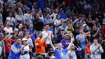 UCLA and Northwestern fans cheer. 