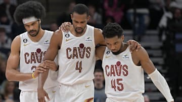 Jan 14, 2023; Minneapolis, Minnesota, USA; Cleveland Cavaliers forward Evan Mobley (4) is helped off the court by guard Donovan Mitchell (45) and center Jarrett Allen (31) during the second quarter at Target Center. Mandatory Credit: Jeffrey Becker-Imagn Images