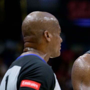 Mar 26, 2024; New Orleans, Louisiana, USA; New Orleans Pelicans forward Zion Williamson (1) reacts to a call with referee Derrick Collins (11)  at Smoothie King Center. Mandatory Credit: Matthew Hinton-Imagn Images