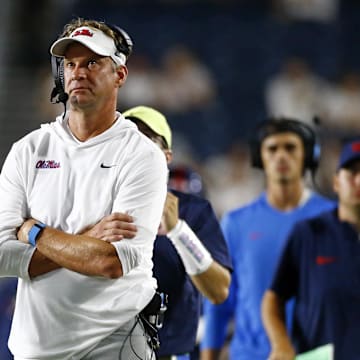 Aug 31, 2024; Oxford, Mississippi, USA; Mississippi Rebels head coach Lane Kiffin looks at the jumbotron during the second half against the Furman Paladins at Vaught-Hemingway Stadium. Mandatory Credit: Petre Thomas-Imagn Images