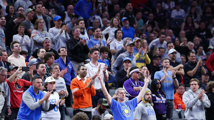 UCLA and Northwestern fans cheer. 