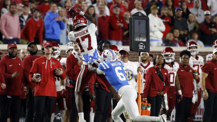 Oct 7, 2023; Oxford, Mississippi, USA; Arkansas Razorbacks wide receiver Tyrone Broden (17) catches the ball as Mississippi Rebels defensive back Zamari Walton (6) defends during the second half at Vaught-Hemingway Stadium. Mandatory Credit: Petre Thomas-USA TODAY Sports