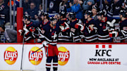 Feb 4, 2025; Winnipeg, Manitoba, CAN;  Winnipeg Jets forward Nino Niederreiter (62) is congratulated by his team mates on his goal against the Carolina Hurricanes during the first period at Canada Life Centre. Mandatory Credit: Terrence Lee-Imagn Images