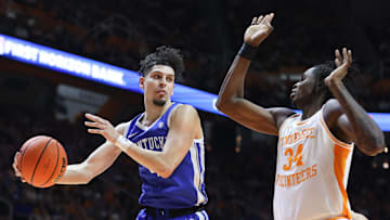 Jan 28, 2025; Knoxville, Tennessee, USA; Kentucky Wildcats guard Koby Brea (4) passes the ball against Tennessee Volunteers forward Felix Okpara (34) during the second half at Thompson-Boling Arena at Food City Center. Mandatory Credit: Randy Sartin-Imagn Images