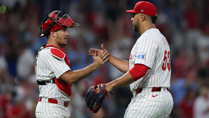 Aug 14, 2024; Philadelphia, Pennsylvania, USA; Philadelphia Phillies relief pitcher Carlos Estevez (53) and catcher J.T. Realmuto (10) shake hands after a victory Miami Marlins at Citizens Bank Park.