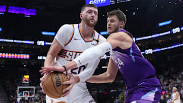 Dec 13, 2024; Salt Lake City, Utah, USA; Phoenix Suns center Jusuf Nurkic (20) and Utah Jazz center Walker Kessler (24) play for a loose ball during the third quarter at Delta Center. Mandatory Credit: Rob Gray-Imagn Images