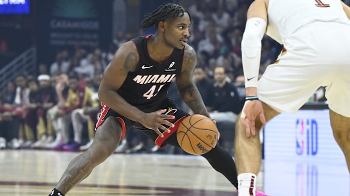 Apr 23, 2025; Cleveland, Ohio, USA; Miami Heat guard Davion Mitchell (45) dribbles beside Cleveland Cavaliers guard Max Strus (1) in the first quarter of game two of the first round of the 2025 NBA Playoffs at Rocket Arena. Mandatory Credit: David Richard-Imagn Images