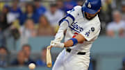 Jul 22, 2025; Los Angeles, California, USA; Los Angeles Dodgers outfielder Michael Conforto (23) breaks a bat Minnesota Twins in the second inning at Dodger Stadium. Mandatory Credit: Jayne Kamin-Oncea-Imagn Images