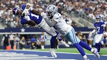 Sep 14, 2025; Arlington, Texas, USA; New York Giants wide receiver Malik Nabers (1) makes a catch for a touchdown against Dallas Cowboys cornerback Trevon Diggs (7) during the second quarter at AT&T Stadium. Mandatory Credit: Kevin Jairaj-Imagn Images