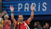 Jul 31, 2024; Paris, France; Rafael Nadal (ESP) waves to the crowd after losing to Austin Krajicek and Rajeev Ram (USA) in a men's doubles quarterfinal tennis match during the Paris 2024 Olympic Summer Games at Stade Roland Garros. 