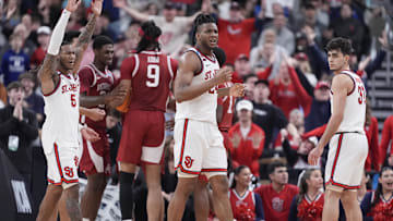 Mar 22, 2025; Providence, RI, USA; St. John's basketball guard Deivon Smith (5), forward Zuby Ejiofor (24) and guard Lefteris Liotopoulos (31) react to a play during the second half of a second round men’s NCAA Tournament game against the Arkansas Razorbacks at Amica Mutual Pavilion.