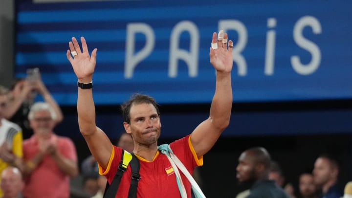 Jul 31, 2024; Paris, France; Rafael Nadal (ESP) waves to the crowd after losing to Austin Krajicek and Rajeev Ram (USA) in a men's doubles quarterfinal tennis match during the Paris 2024 Olympic Summer Games at Stade Roland Garros. 