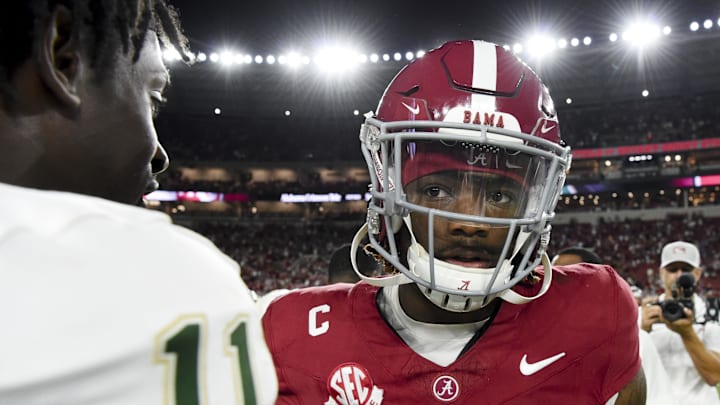 Sep 7, 2024; Tuscaloosa, Alabama, USA;  South Florida Bulls defensive end D.J. Harris (11) congratulates Alabama Crimson Tide quarterback Jalen Milroe (4) at Bryant-Denny Stadium. Alabama won 42-16. Mandatory Credit: Gary Cosby Jr.-Imagn Images