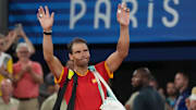 Jul 31, 2024; Paris, France; Rafael Nadal (ESP) waves to the crowd after losing to Austin Krajicek and Rajeev Ram (USA) in a men's doubles quarterfinal tennis match during the Paris 2024 Olympic Summer Games at Stade Roland Garros. Mandatory Credit: Kirby Lee-Imagn Images