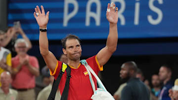 Jul 31, 2024; Paris, France; Rafael Nadal (ESP) waves to the crowd after losing to Austin Krajicek and Rajeev Ram (USA) in a men's doubles quarterfinal tennis match during the Paris 2024 Olympic Summer Games at Stade Roland Garros. Mandatory Credit: Kirby Lee-Imagn Images