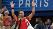 Jul 31, 2024; Paris, France; Rafael Nadal (ESP) waves to the crowd after losing to Austin Krajicek and Rajeev Ram (USA) in a men's doubles quarterfinal tennis match during the Paris 2024 Olympic Summer Games at Stade Roland Garros. Mandatory Credit: Kirby Lee-Imagn Images