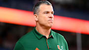 Nov 30, 2024; Syracuse, New York, USA; Miami Hurricanes head coach Mario Cristobal looks on prior to the game against the Syracuse Orange at the JMA Wireless Dome. Mandatory Credit: Rich Barnes-Imagn Images