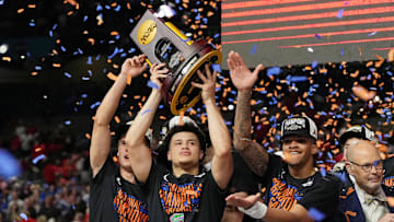 Apr 7, 2025; San Antonio, TX, USA; Florida Gators guard Walter Clayton Jr. (1) holds up the trophy after winning the national championship game of the Final Four of the 2025 NCAA Tournament at the Alamodome. Mandatory Credit: Bob Donnan-Imagn Images