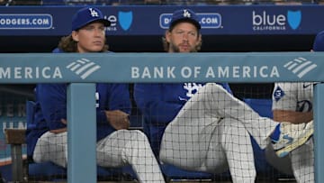Sep 17, 2025; Los Angeles, California, USA;  Los Angeles Dodgers starting pitcher Tyler Glasnow (31) and starting pitcher Clayton Kershaw (22) look on from the dugout in the sixth inning against the Philadelphia Phillies at Dodger Stadium. Mandatory Credit: Jayne Kamin-Oncea-Imagn Images