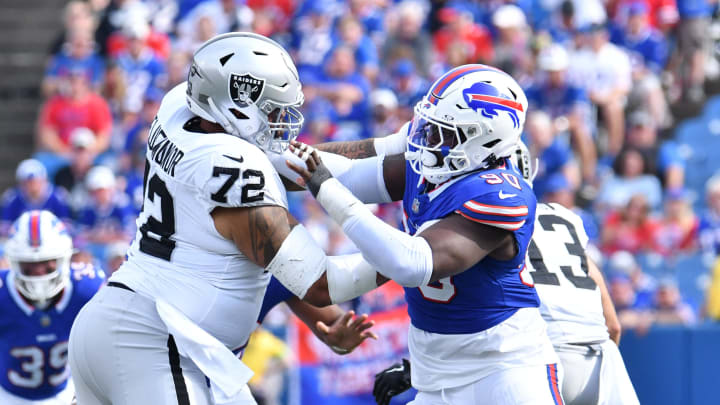 Sep 17, 2023; Orchard Park, New York, USA; Buffalo Bills defensive end Shaq Lawson (90) pass rushes against Las Vegas Raiders guard Jermaine Eluemunor (72) in the fourth quarter at Highmark Stadium.  