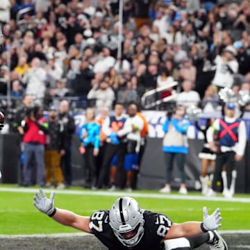 Dec 14, 2023; Paradise, Nevada, USA; Las Vegas Raiders running back Zamir White (35) celebrates after scoring a touchdown against the Los Angeles Chargers in the first quarter at Allegiant Stadium. Mandatory Credit: Stephen R. Sylvanie-Imagn Images