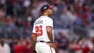 Apr 21, 2025; Atlanta, Georgia, USA; Atlanta Braves relief pitcher Raisel Iglesias (26) reacts after giving up a home run against the St. Louis Cardinals in the ninth inning at Truist Park. Mandatory Credit: Brett Davis-Imagn Images
