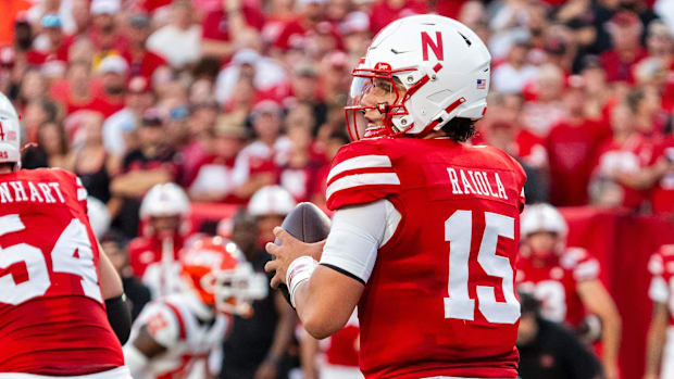 Nebraska Cornhuskers quarterback Dylan Raiola (15) drops to throw against the Illinois