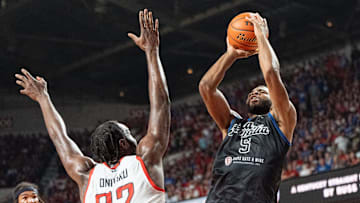 La Familia's Andrew Harrison (5) goes for a jump shot against The Ville's Chinanu Onuaku (32) during their game on Monday, July 29, 2024 at Freedom Hall in Louisville, Ky. during the quarter finals of The Basketball Tournament.
