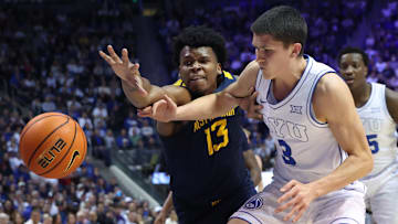 Mar 1, 2025; Provo, Utah, USA; West Virginia Mountaineers forward Amani Hansberry (13) and Brigham Young Cougars guard Egor Demin (3) battle for a loose ball during the first half at Marriott Center. Mandatory Credit: Rob Gray-Imagn Images