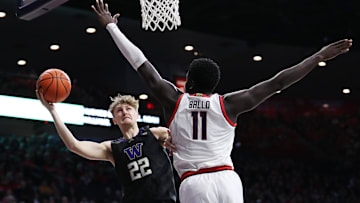 Washington guard Cole Bajema (22) drives to the basket against Arizona center Oumar Ballo (11) at the McKale Center. 