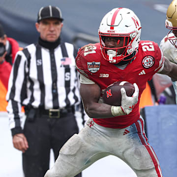 Nebraska running back Emmett Johnson scores a touchdown against Boston College in Pinstripe Bowl. Will the Huskers have momentum from last season's bowl victory?