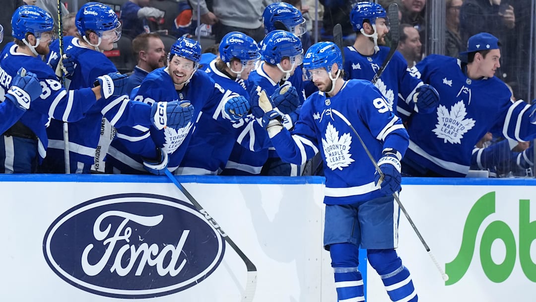 Dec 13, 2025; Toronto, Ontario, CAN; Toronto Maple Leafs defenseman Oliver Ekman-Larsson (95) celebrates at the bench after scoring a goal against the Edmonton Oilers during the second period at Scotiabank Arena. Mandatory Credit: Nick Turchiaro-Imagn Images