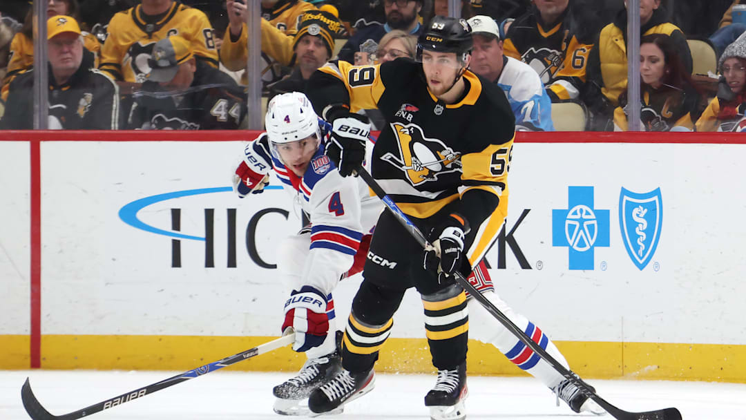 Jan 31, 2026; Pittsburgh, Pennsylvania, USA; Pittsburgh Penguins right wing Egor Chinakhov (59) moves the puck against New York Rangers defenseman Braden Schneider (4) during the second period at PPG Paints Arena. Mandatory Credit: Charles LeClaire-Imagn Images Jan 31, 2026; Pittsburgh, Pennsylvania, USA; Pittsburgh Penguins right wing Egor Chinakhov (59) moves the puck against New York Rangers defenseman Braden Schneider (4) during the second period at PPG Paints Arena. Mandatory Credit: Charles LeClaire-Imagn Images