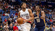 Nov 12, 2025; New Orleans, Louisiana, USA;  
Portland Trail Blazers forward Toumani Camara (33) dribbles against New Orleans Pelicans forward Kevon Looney (55) during the first half at Smoothie King Center. Mandatory Credit: Stephen Lew-Imagn Images