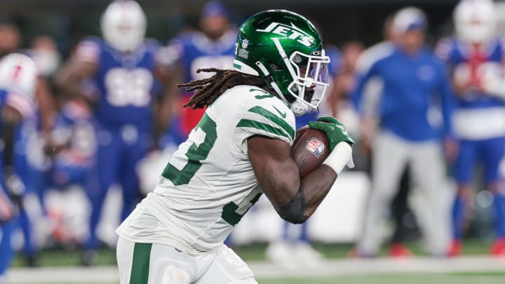 Sep 11, 2023; East Rutherford, New Jersey, USA; New York Jets running back Dalvin Cook (33) carries the ball against the Buffalo Bills during the first half at MetLife Stadium. Mandatory Credit: Vincent Carchietta-USA TODAY Sports
