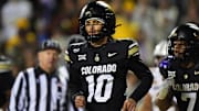 Nov 22, 2025; Boulder, Colorado, USA; Colorado Buffaloes quarterback Julian Lewis (10) following his third quarter touchdown against the Arizona State Sun Devils at Folsom Field. Mandatory Credit: Ron Chenoy-Imagn Images