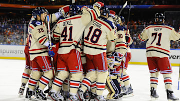 Jan 2, 2012; Philadelphia, PA, USA; New York Rangers players mob goalie Henrik Lundqvist (30) and celebrate after the 2012 Winter Classic against the Philadelphia Flyers at Citizens Bank Park.  The Rangers won 3-2. Mandatory Credit: Dale Zanine-Imagn Images