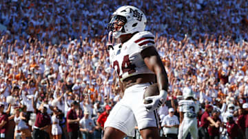 Sep 27, 2025; Starkville, Mississippi, USA; Mississippi State Bulldogs running back Fluff Bothwell (24) celebrates after a touchdown against the Tennessee Volunteers during the first half at Davis Wade Stadium at Scott Field. Mandatory Credit: Wesley Hale-Imagn Images