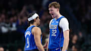 Dec 3, 2025; Dallas, Texas, USA;  Dallas Mavericks forward Cooper Flagg (32) celebrates with Dallas Mavericks guard Ryan Nembhard (9) after scoring during the fourth quarter against the Miami Heat at American Airlines Center. Mandatory Credit: Kevin Jairaj-Imagn Images
