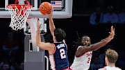 Illinois Fighting Illini guard Andrej Stojakovic (2) shoots over Ohio State Buckeyes guard Bruce Thornton (2) during the first half of the NCAA men's basketball game in Columbus on Dec. 9, 2025. Ohio State lost 86-78.