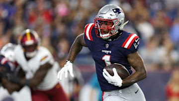 Aug 8, 2025; Foxborough, Massachusetts, USA; New England Patriots receiver Ja'Lynn Polk (1) runs the ball during the first half against the Washington Commanders at Gillette Stadium. Mandatory Credit: Paul Rutherford-Imagn Images