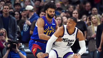 Nov 22, 2025; Denver, Colorado, USA; Sacramento Kings guard Russell Westbrook (18) handles the ball against Denver Nuggets guard Jamal Murray (27) during the first half at Ball Arena. Mandatory Credit: Christopher Hanewinckel-Imagn Images