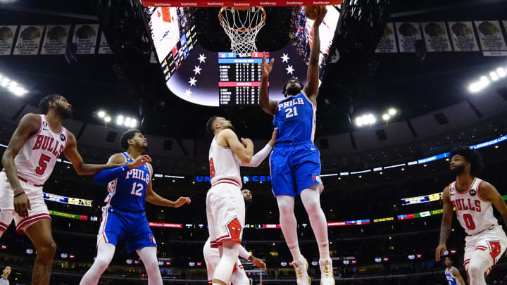 Mar 22, 2023; Chicago, Illinois, USA; Chicago Bulls guard Zach LaVine (8) defends Philadelphia 76ers center Joel Embiid (21) during the first half at United Center. Mandatory Credit: David Banks-USA TODAY Sports