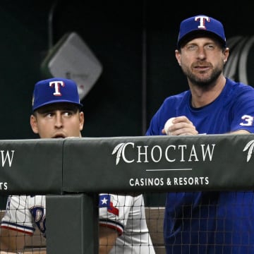 Jun 3, 2024; Arlington, Texas, USA; Texas Rangers starting pitcher Max Scherzer (31) watches from the dugout during the sixth inning against the Detroit Tigers at Globe Life Field. Mandatory Credit: Jerome Miron-USA TODAY Sports