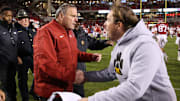 Arkansas Razorbacks head coach Sam Pittman shakes hands with Missouri Tigers head coach Eil Drinkwitz after the game at Donald W. Reynolds Razorbacks Stadium. Arkansas won 34-17.